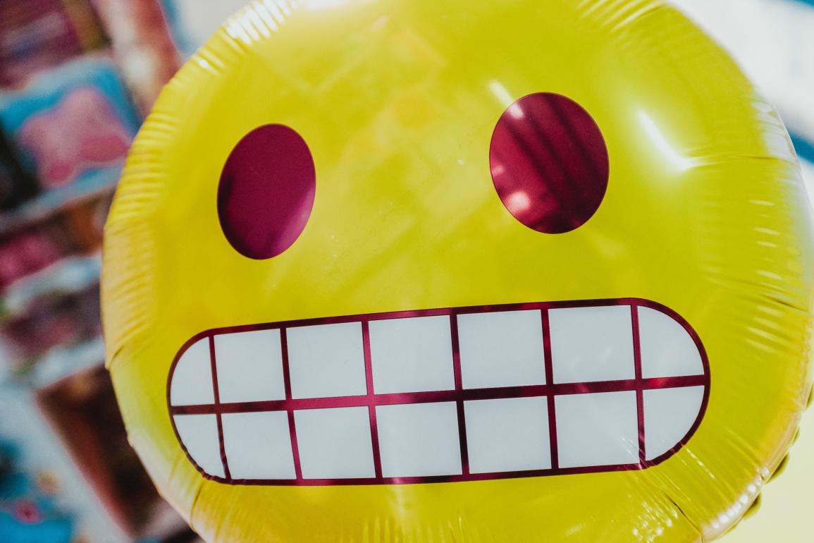 Yellow balloon emoji looking skeptical.